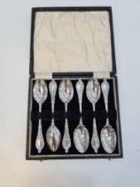 A cased set of six quality silver teaspoons, the handles terminating in embossed design in relief. H
