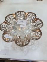 A pretty silver pierced bon bon dish on a circular foot, having petal design rim and decorative pier