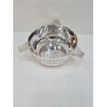 A silver bowl hallmarked Sheffield 1921, William Hutton and Sons Ltd. Having three handles, and the