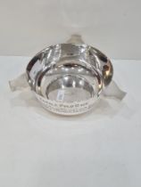 A silver bowl hallmarked Sheffield 1921, William Hutton and Sons Ltd. Having three handles, and the