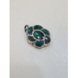 A very pretty silver vinaigrette of flower form, having green stone lid and heavily decorated base o