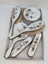 Garrard and Co Ltd., a stunning silver and enamel dressing table set consisting of brushes, a mirror