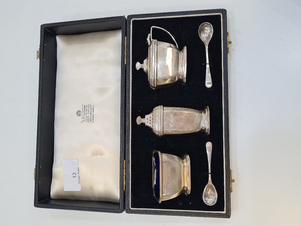 A cased cruet set by Garrad and Co. Ltd, in the matching case, Birmingham 1958, with miscellaneous s