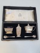 A cased cruet set by Garrad and Co. Ltd, in the matching case, Birmingham 1958, with miscellaneous s