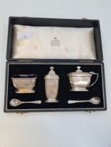 A cased cruet set by Garrad and Co. Ltd, in the matching case, Birmingham 1958, with miscellaneous s