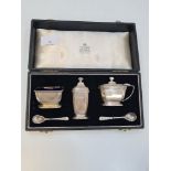 A cased cruet set by Garrad and Co. Ltd, in the matching case, Birmingham 1958, with miscellaneous s