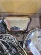 A pair of Edwardian silver wishbone tongs by E S Barnsley and Co., Birmingham1909. With a pierced de