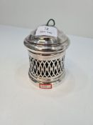 An Edwardian silver string pot having a pierced decorative body, and raised pedestal foot and lid. E