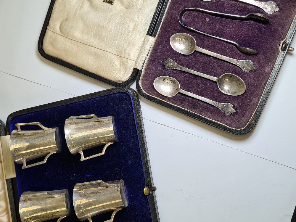 Cased silver teaspoons and sugar tong, excluding one teaspoon, having decorative handle ends, hallma - Image 6 of 15