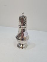 A silver sugar sifter by James Dixon and Sons, Sheffield 1946. Having engraved reeded pedestal foot