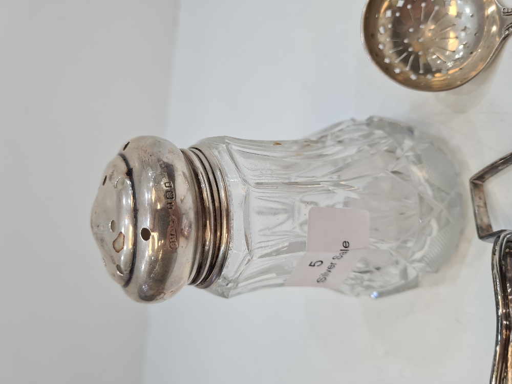 A silver topped sugar sifter having cut glass body and silver top having circular pierced details. H - Image 7 of 8