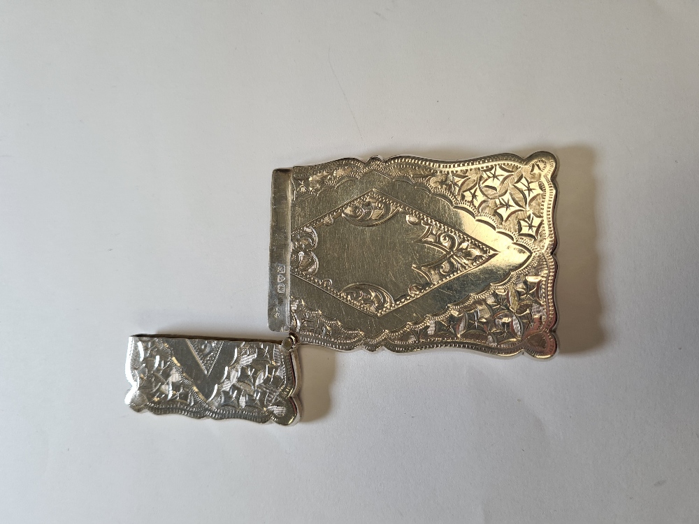 A silver card case decorative engraved body with a diamond shaped cartouche. Hallmarked Chester 1913 - Image 2 of 4