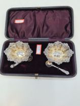 A pretty Victorian cased salt set consisting of ornate, decorative salts having fitted base interior