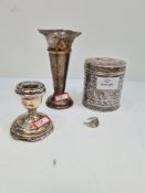 A silver vase having crimped rim, a miniature candlestick and a white metal engraved cylindrical box