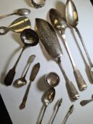 A large silver Georgian serving spoon, by Thomas Dicks, London 1825. With a similar example by Richa