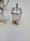 A silver Victorian tea service by Walker and Hall, having half reeded body, comprising of a tea serv