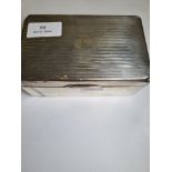 A silver cigarette box of rectangular form, having stripped lid with 'K' initialled in the centre. H