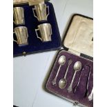 Cased silver teaspoons and sugar tong, excluding one teaspoon, having decorative handle ends, hallma