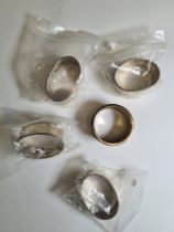 A set of four silver napkin rings marked 925, with one other example. 3.02ozt approx