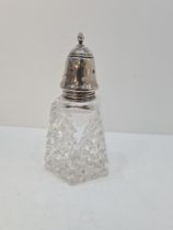 A pretty silver topped cut glass sugar sifter having pierced star top. Pointed shaped finial, and ha