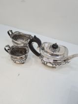 A pretty silver Victorian tea service having intricate details; reeded rims, engraved banded body of