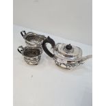 A pretty silver Victorian tea service having intricate details; reeded rims, engraved banded body of