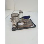 A mixed silver lot comprising of silver topped glass items, salt, pepper and other similar items. Th