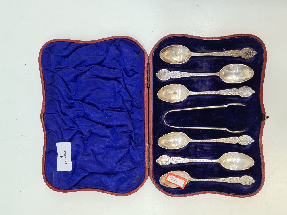 A cased set of Victorian silver teaspoons and sugar tongs. The handles being ornate and decorative,