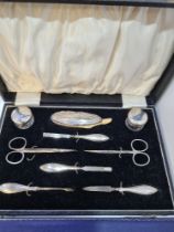 A boxed manicure set by Hanset and Harper Ltd., Birmingham 1926. Comprising silver handled items, gl