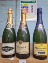 A bottle of Taittinger Reserve Champagne, and two bottles of Heidsieck Champagne (3)