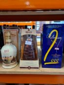 Bells Millennium 2000 Whisky, in original box, Courvoisier Millennium Cognac and a bottle of Famous