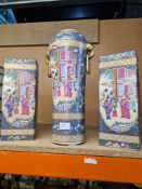 A pair of 20th Century, Chinese oblong pillars and a matching vase having elephant handles, the vase