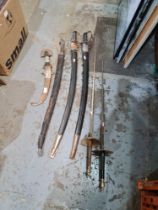 Reproduction swords, an Eastern dagger, etc