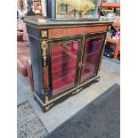 A late Victorian ebonized and Boville decorated display cabinet having 2 doors and metal mounts A/F