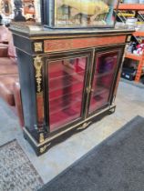 A late Victorian ebonized and Boville decorated display cabinet having 2 doors and metal mounts A/F