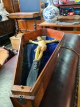 A circa 1900 painted wooden figure of Jesus on Cross in fitted coffin shaped mahogany box, length 86