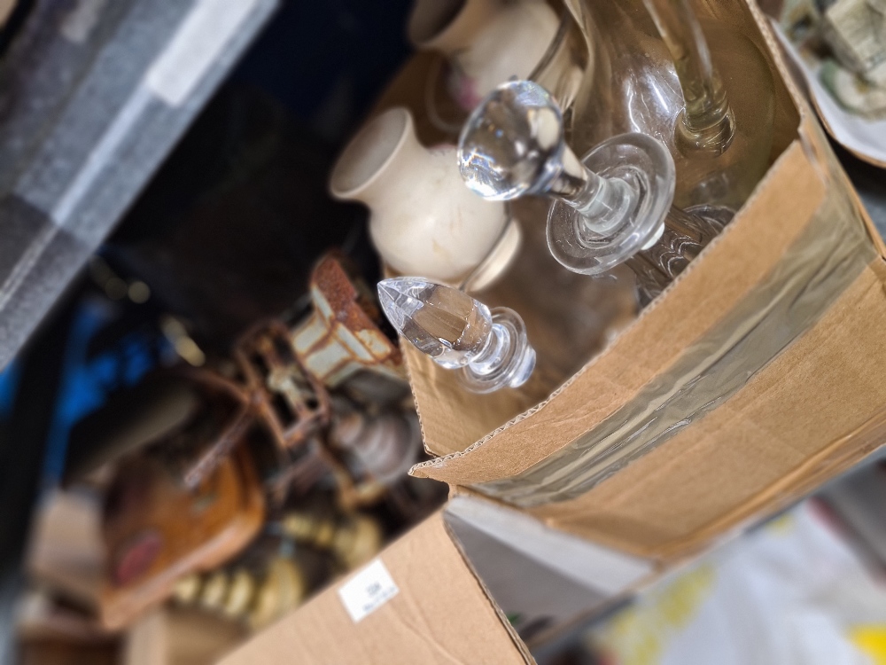 A selection of glass decanters, vintage scales and brassware