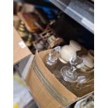 A selection of glass decanters, vintage scales and brassware