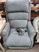 An almost new electric reclining armchair