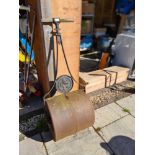 A vintage cast iron garden roller