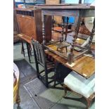 An antique mahogany D-end dining table with central two flap gateleg turned legs, maximum length 279