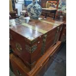 An oriental camphor wood chest having engraved brass decoration, 101.5cm