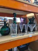 An amethyst glass jug, a Victorian green glass decanter and other glassware