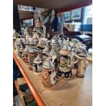 A large selection of German steins, majority with pewter lids
