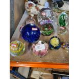 A small quantity of glass paperweights, some large examples included