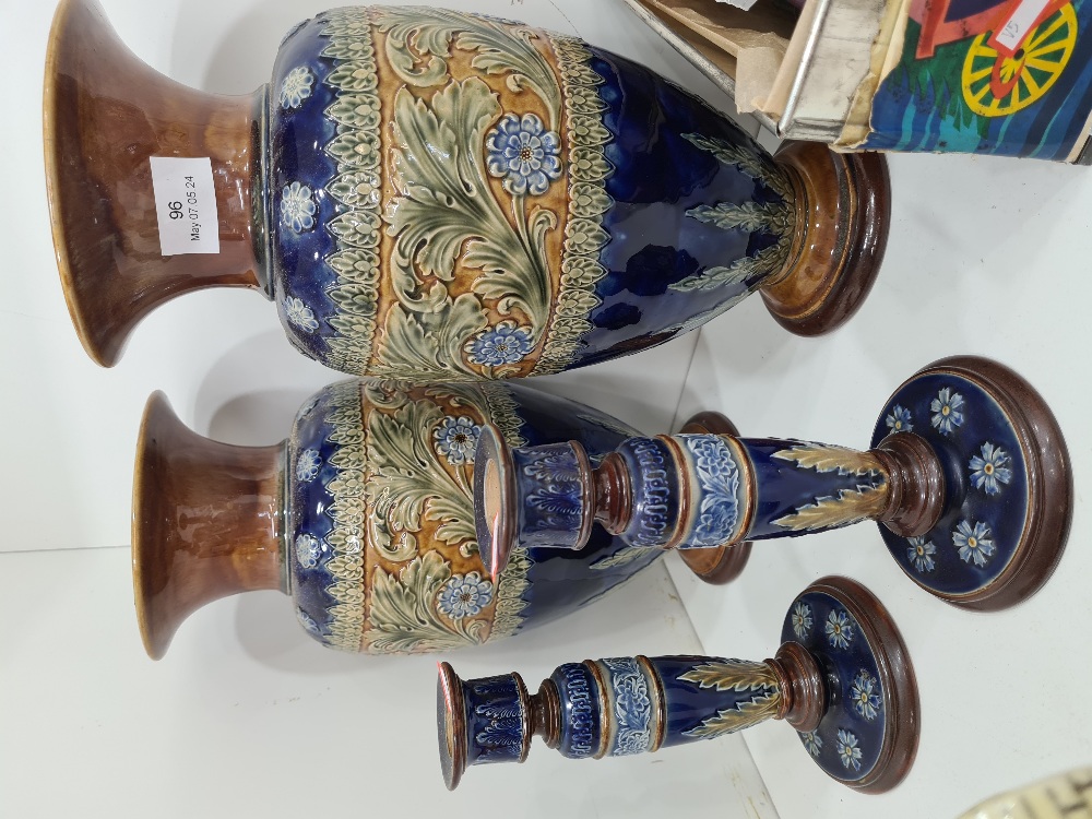 A pair of Royal Doulton stoneware vases having floral band, 34.5cm and a pair of Lambeth candlestick