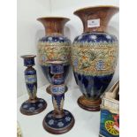 A pair of Royal Doulton stoneware vases having floral band, 34.5cm and a pair of Lambeth candlestick
