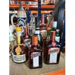A selection of various bottles including Napoleon Brandy, Cointreau, Grand Marnier, etc
