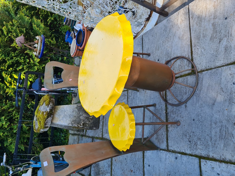 A Bistro table with 2 chairs decorated bottle tops