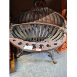 A steel oval fire basket
